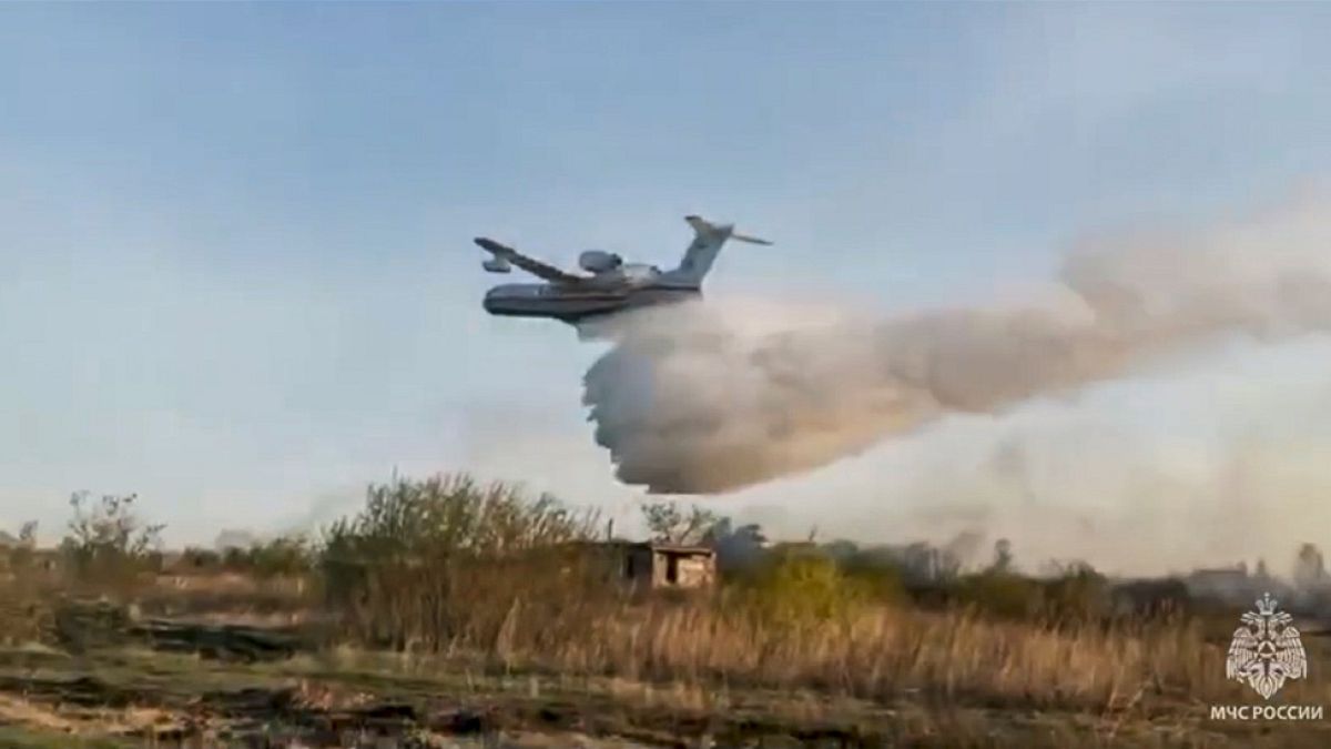 May 8, 2023, a Russian Emergency Ministry's Beriev multipurpose amphibious aircraft Be-200 drops water during extinguishing a forest fire in Kurgan region, Russia.