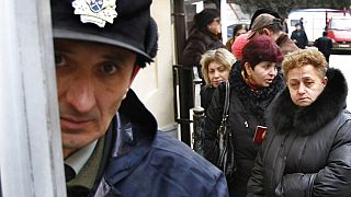 People lined up to get Russian visas in the Georgian capital, Tbilisi, at the Swiss consulate, which acted as a mediator between Russia and Georgia, Monday, March 12, 2012.