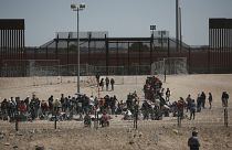 Migrants wait for US authorities at the US-Mexico border, as seen from Ciudad Juarez, Mexico, Wednesday, May 10, 2023