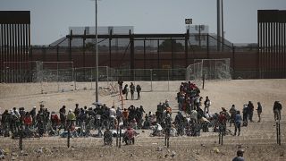 Migrants wait for US authorities at the US-Mexico border, as seen from Ciudad Juarez, Mexico, Wednesday, May 10, 2023