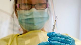 FILE - A physician assistant prepares a syringe with the Mpox vaccine for a patient at a vaccination clinic in New York on Friday, Aug. 19, 2022