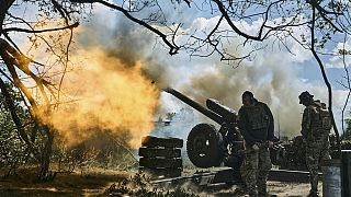 Ukrainian soldiers fire a cannon near Bakhmut, an eastern city in the Donetsk region, Ukraine, Friday, May 12, 2023 