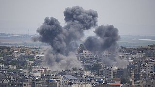 Smoke rises from an explosion caused by an Israeli airstrike, in Gaza Strip, Friday, May 12, 2023. 