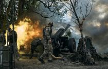 Ukrainian soldiers fire a cannon near Bakhmut, an eastern city where fierce battles against Russian forces have been taking place.