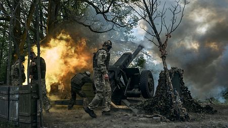 Ukrainian soldiers fire a cannon near Bakhmut, an eastern city where fierce battles against Russian forces have been taking place.
