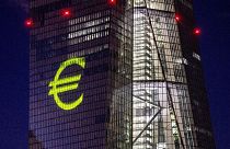 A light installation is projected onto the building of the European Central Bank during a rehearsal in Frankfurt, Germany, Dec. 30, 2021.