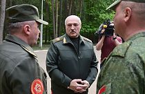In this handout photo released by Belarus' Presidential Press Office, President Lukashenko, centre, visits Air Force and Air Defense Forces in Belarus, Monday, May 15, 2023.