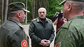 In this handout photo released by Belarus' Presidential Press Office, President Lukashenko, centre, visits Air Force and Air Defense Forces in Belarus, Monday, May 15, 2023. 