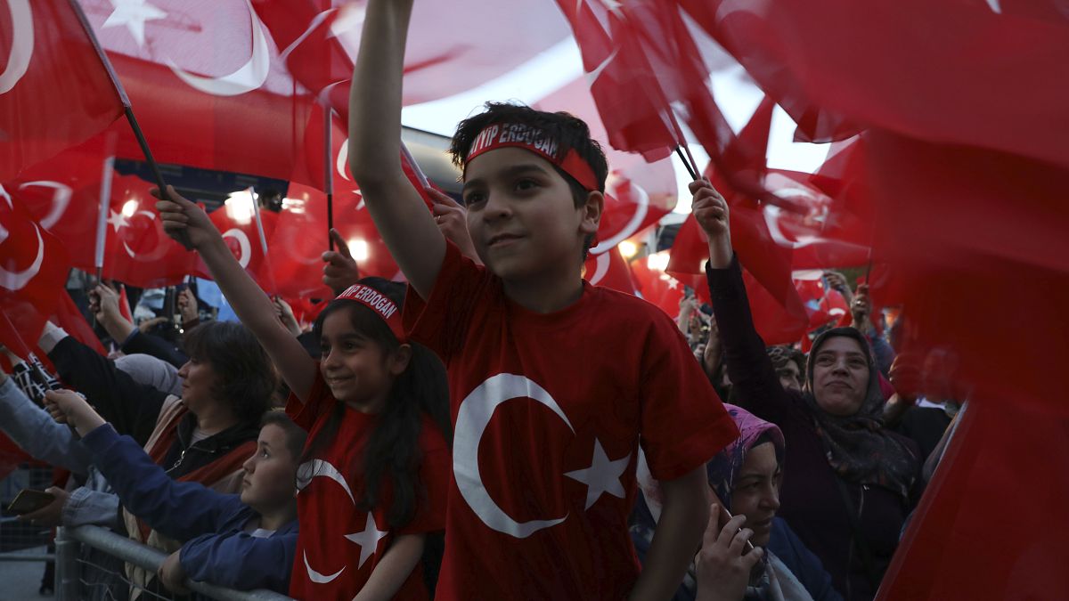 Supporters of Turkish President Recep Tayyip Erdogan's ruling party gather at the party headquarters, in Ankara, Turkey, Sunday, May 14, 2023. 