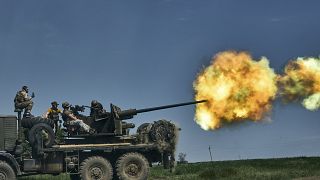 Ukrainian soldiers fire a cannon near Bakhmut, an eastern city where fierce battles against Russian forces have been taking place, in the Donetsk region, Ukraine, Monday, May