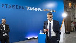 Greece's Prime Minister and New Democracy leader Kyriakos Mitsotakis, drinks coffee ahead of a news conference at Lavrio town, southeast of Athens, Greece, May 14, 2023