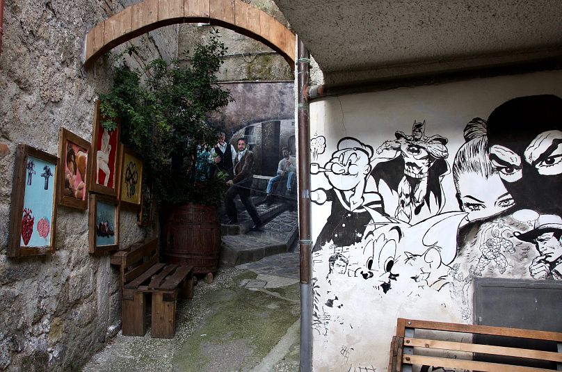Murals line the tiny streets of Valogno in southern Italy
