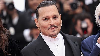 Johnny Depp poses for photographers upon arrival at the opening ceremony and the premiere of the film 'Jeanne du Barry' at the 76th international film festival in Cannes.