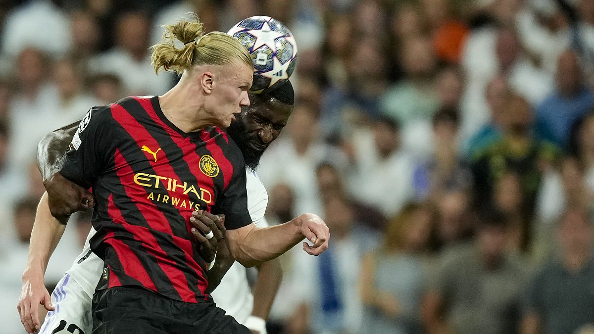 Manchester City's Erling Haaland with Real Madrid's Antonio Rudiger during the Champions League semifinal first leg match between Real Madrid and Manchester City, 9 May 2023