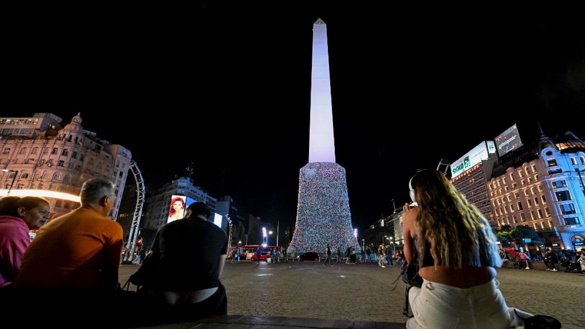 General view of the Obelisk covered with plastic bags as part of an artistic intervention on the eve of World Recycling Day in Buenos Aires, taken on May 16, 2023