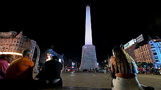 General view of the Obelisk covered with plastic bags as part of an artistic intervention on the eve of World Recycling Day in Buenos Aires, taken on May 16, 2023