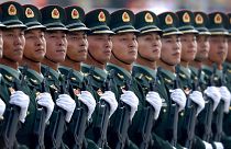 Chinese People's Liberation Army soldiers march in formation during a parade to commemorate the 70th anniversary of the founding of the People's Republic of China in Beijing