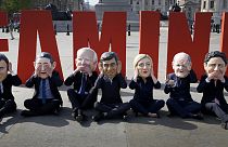 Oxfam's satirical 'big heads' of the G7 leaders pose ahead of the start of the G7 summit in Japan, in Trafalgar Square, London, Wednesday, May 17, 2023.