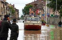 Firefighters arrive in the flooded village of Castel Bolognese, Italy, Wednesday, 17 May.