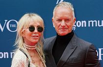 British musician and songwriter Sting and his wife Trudie Styler arrive for the annual Ivor Novello Awards at Grosvenor House in London