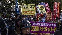 Protesters gather near the famed Atomic Bomb Dome ahead of the Group of Seven nations' meetings in Hiroshima, western Japan, Wednesday, May 17, 2023.