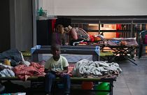 Displaced people prepare to spend the night in a dormitory set up on May 18, 2023 in the Classis museum of Ravenna.