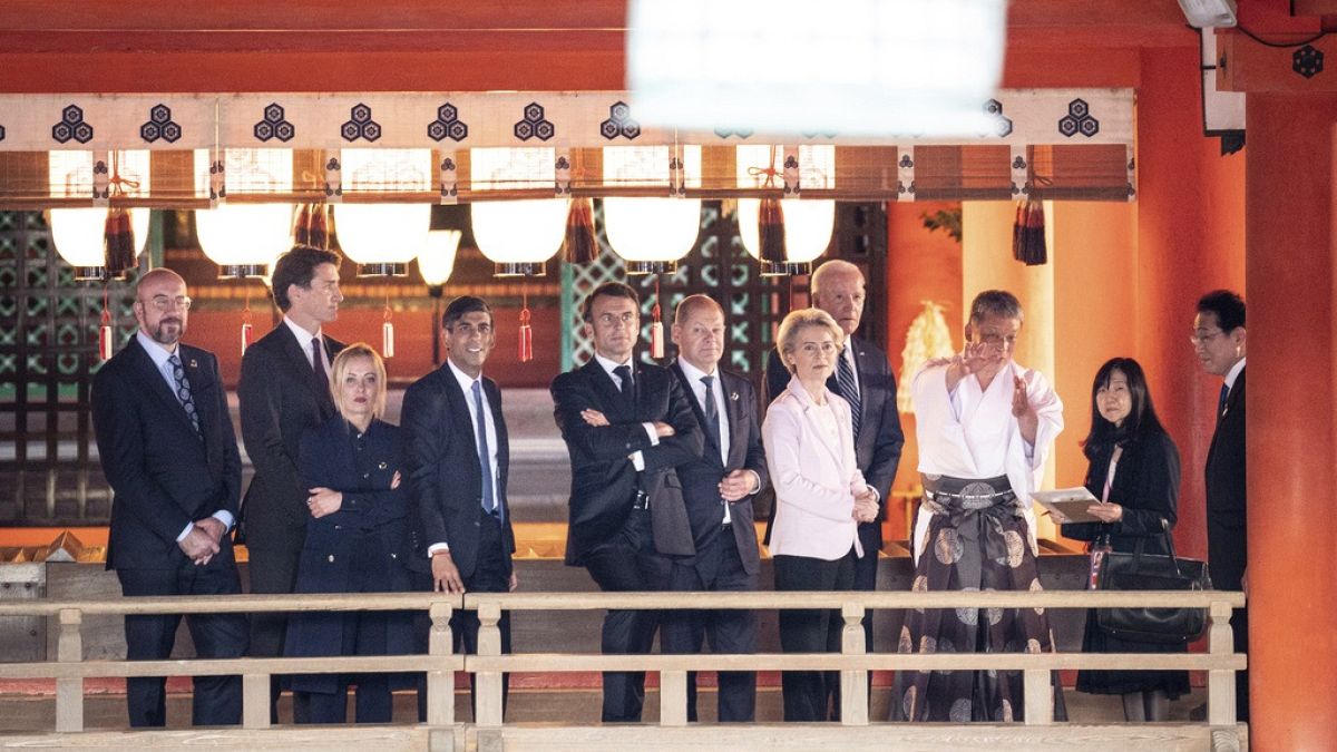 From left, Charles Michel, Justin Trudeau, Giorgia Meloni, Rishi Sunak, Emmanuel Macron, Olaf Scholz, Ursula von der Leyen and Joe Biden  with Fumio Kishida.