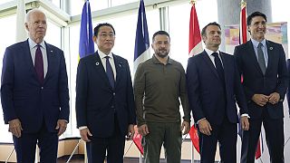 US President Joe Biden (far left), Japan's Fumio Kishida, (far right) Canadian leader Justin Trudeau and France's Emmanuel Macron stand with Ukrainne's Volodymyr Zelenskyy.