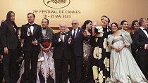 William Belleau, Leonardo DiCaprio, Tantoo Cardinal, director Martin Scorsese, Robert De Niro, Cara Jade Myers, Lily Gladstone and Jillian Dion pose for photographers.
