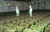 FILE - In this Saturday, May 20, 2000 file photo, two Russian soldiers make a routine check of metal containers with toxic agents at a chemical weapons storage site.