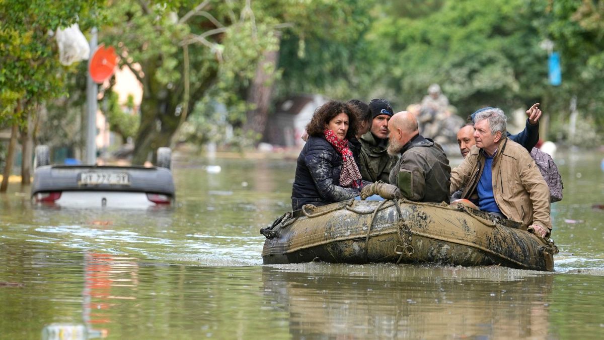 People are rescued from the floods in Faenza, Italy, 18 May 2023.