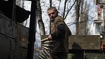  A Ukrainian soldier carries cartridges in war-hit Bakhmut, Donetsk region, Ukraine.
