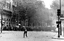 A student throws stones at police in Paris, France, during a student strike in May 1968.