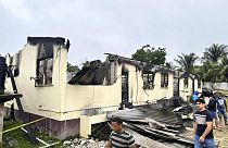 The burnt-out dormitory of a secondary school is burned in Mahdia, Guyana, Monday, May 22, 2023.