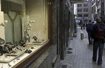 People pass a jewelry store in the diamond quarter in Antwerp, Belgium.