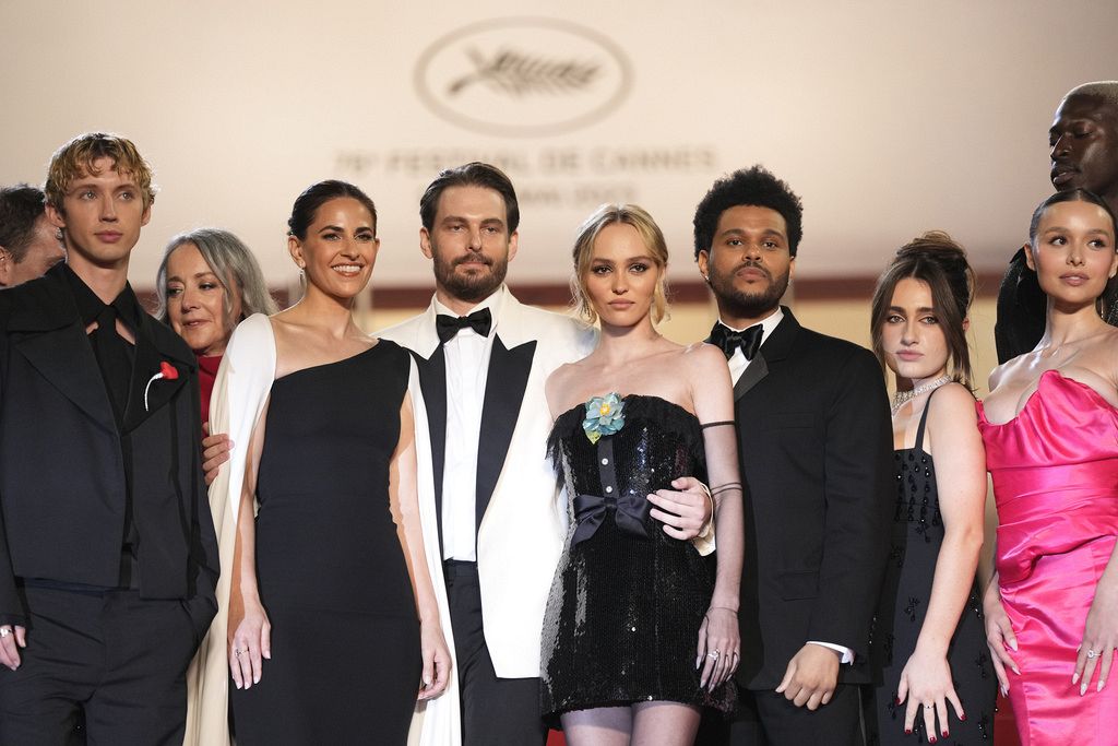Lily-Rose Depp dazzles in a bright orange mini-dress in Cannes
