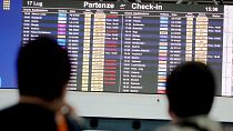 A screen displaying canceled flights is seen in Rome's Leonardo Da Vinci international airport, Sunday, July 17, 2022. 