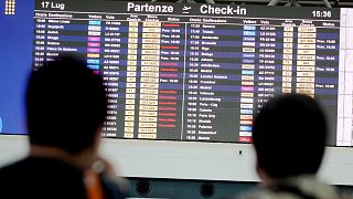 A screen displaying canceled flights is seen in Rome's Leonardo Da Vinci international airport, Sunday, July 17, 2022. 
