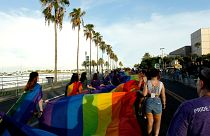 n this Saturday, June 24, 2017, file photo, volunteers lead a large rainbow banner during a gay pride parade in St. Petersburg, Florida.