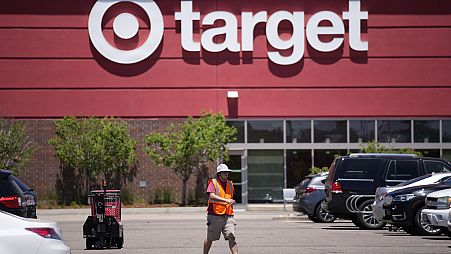 An employee walks outside a Target store in Colorado, United States.