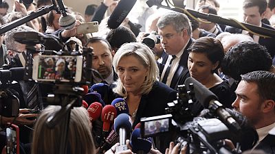 French far-right leader Marine Le Pen speaks to medias at the National Assembly in Paris, Thursday, March 16, 2023