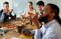 Is this the end of office pizza parties? Companies are cutting costs and work perks are on the chopping block.