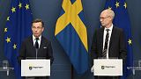 Sweden's Prime Minister Ulf Kristersson (L) and Oscar Stenström, a chief negotiator in the NATO process, hold a press briefing in Stockholm, Sweden, March 14, 2023. 