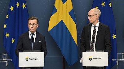 Sweden's Prime Minister Ulf Kristersson (L) and Oscar Stenström, a chief negotiator in the NATO process, hold a press briefing in Stockholm, Sweden, March 14, 2023.