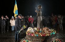People light candles and lay flowers at the monument of the victims of the Holodomor in Kyiv, Ukraine. 26 November 2022