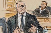 An artist sketch depicts the trial of Oath Keepers leader Stewart Rhodes as he testifies before U.S. District Judge Amit Mehta