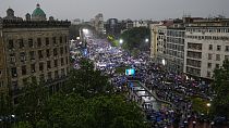 People attend a major rally in support of President Aleksandar Vucic in front of the Serbian parliament building in Belgrade, Serbia, Friday, May 26, 2023.