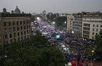 People attend a major rally in support of President Aleksandar Vucic in front of the Serbian parliament building in Belgrade, Serbia, Friday, May 26, 2023.