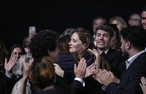 Justine Triet, centre, is congratulated upon winning the Palme d'Or for 'Anatomy of a Fall,' during the awards ceremony of the 76th international film festival, Cannes.