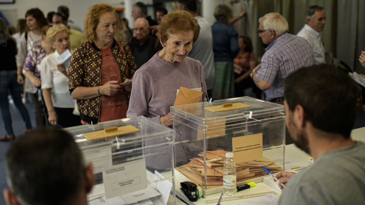 Spaniards casting their vote during regional elections, in Olite, northern Spain.